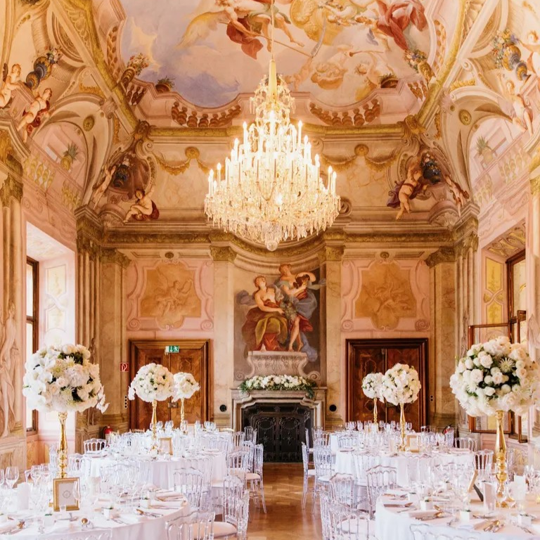 Chich wedding hall with breaking flower arrangements and paintings.