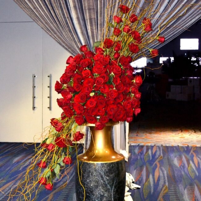 Large event floral arrangement of red roses for a dramatic entrance display