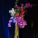 Stunning floral arrangement for nighttime event.