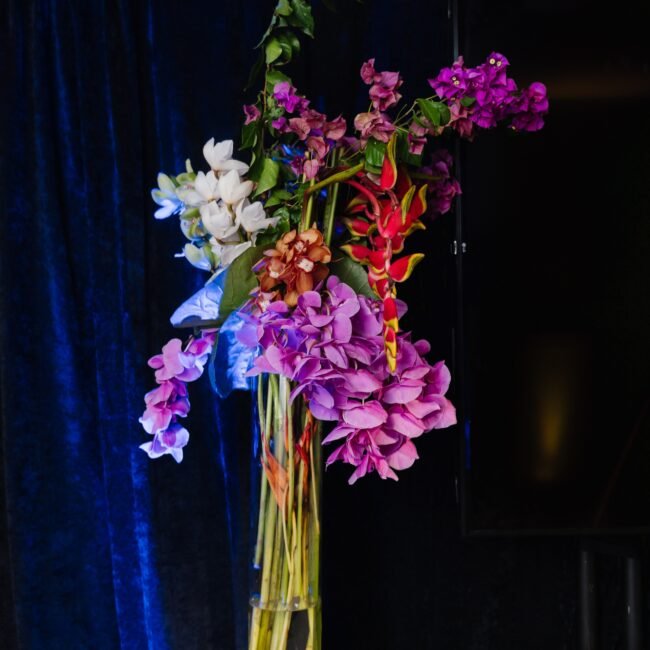 Stunning floral arrangement for nighttime event.